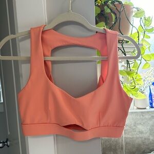 Cleo Harper Sports Bra size medium the color is coral. No bra pads inside.